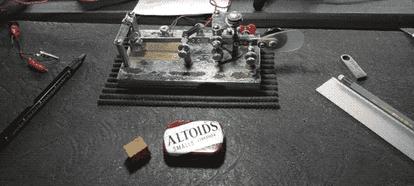 Picture with vibroplex telegraph key, relay and altoids tin